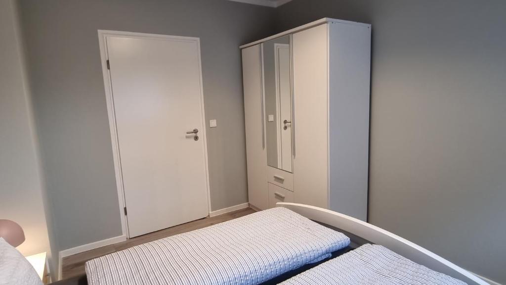 Postel nebo postele na pokoji v ubytování Haus Spökenkieker Loppersum