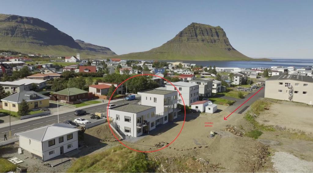 an aerial view of a city with a red circle around a house at Hafnir in Grundarfjordur