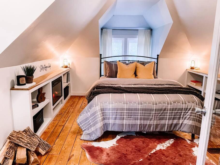 a bedroom with a bed in a attic at Lighthouse Cottage - Family Friendly Kids and Pets in New Buffalo