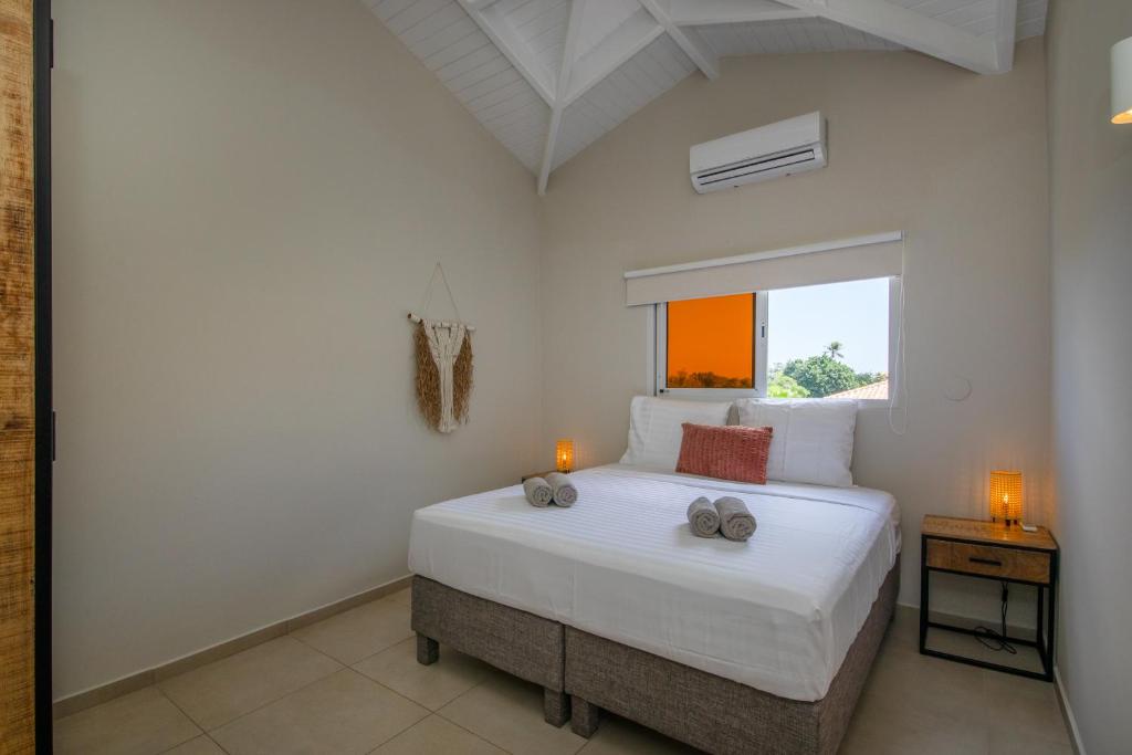 Postel nebo postele na pokoji v ubytování JT Curacao Apartments