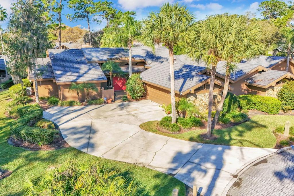 an aerial view of a house with palm trees at Resort Palm Retreat in Wesley Chapel