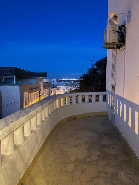 a bridge over a walkway on top of a building at Nomads Hostel Tunisia in Tunis