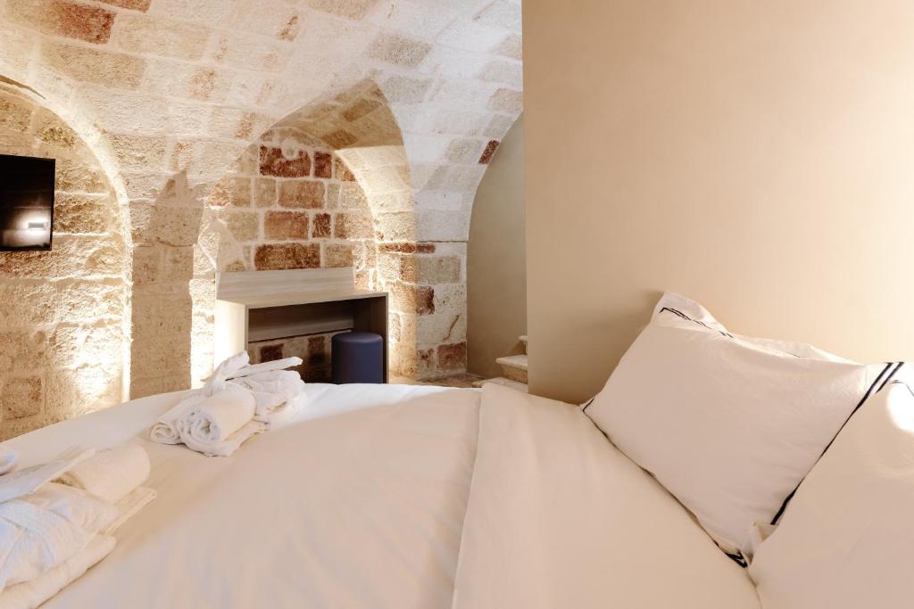 Postel nebo postele na pokoji v ubytování Aeris Suite & Relax