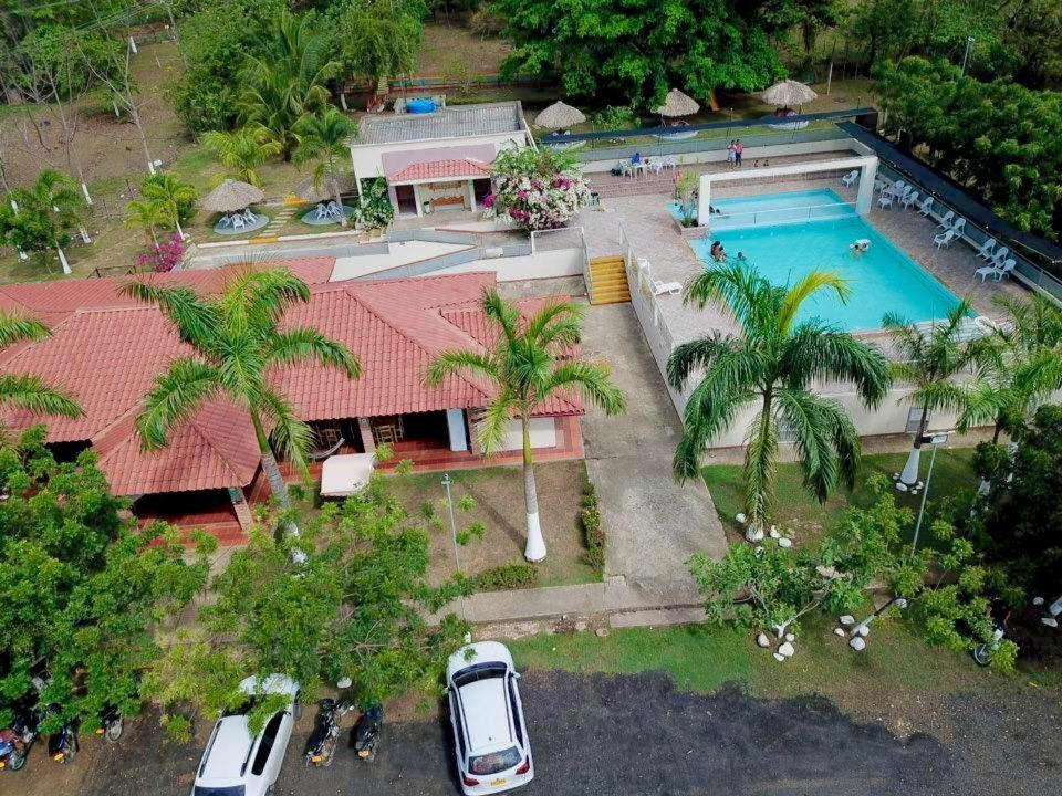 an aerial view of a house with a swimming pool at CENTRO RECREACIONAL DEL SAN JUAN in San Juan de Urabá