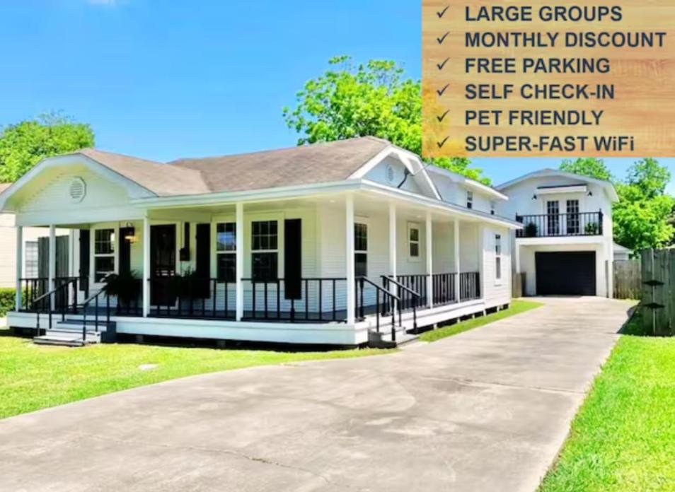 a house with a large driveway in front of it at 6 BRs Spacious Charming House, Great Neighborhood in Groves
