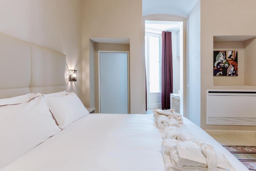 Postel nebo postele na pokoji v ubytování Aeris Suite & Relax