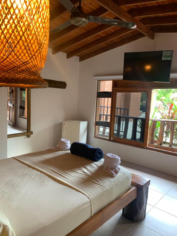 מיטה או מיטות בחדר ב-Hotel Tekal del Rio