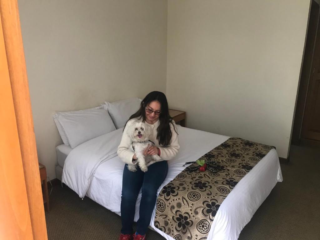 Postel nebo postele na pokoji v ubytování Hotel Casa La Riviera