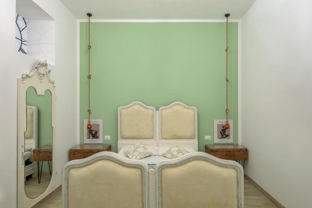 Łóżko lub łóżka w pokoju w obiekcie Casa Caterina