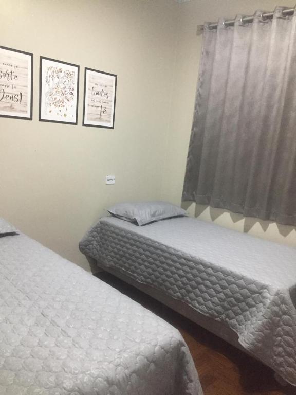 Postel nebo postele na pokoji v ubytování IDEAL HOTEL