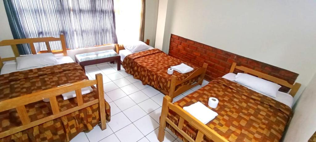 Un ou plusieurs lits dans un hébergement de l'établissement Andes Hostel