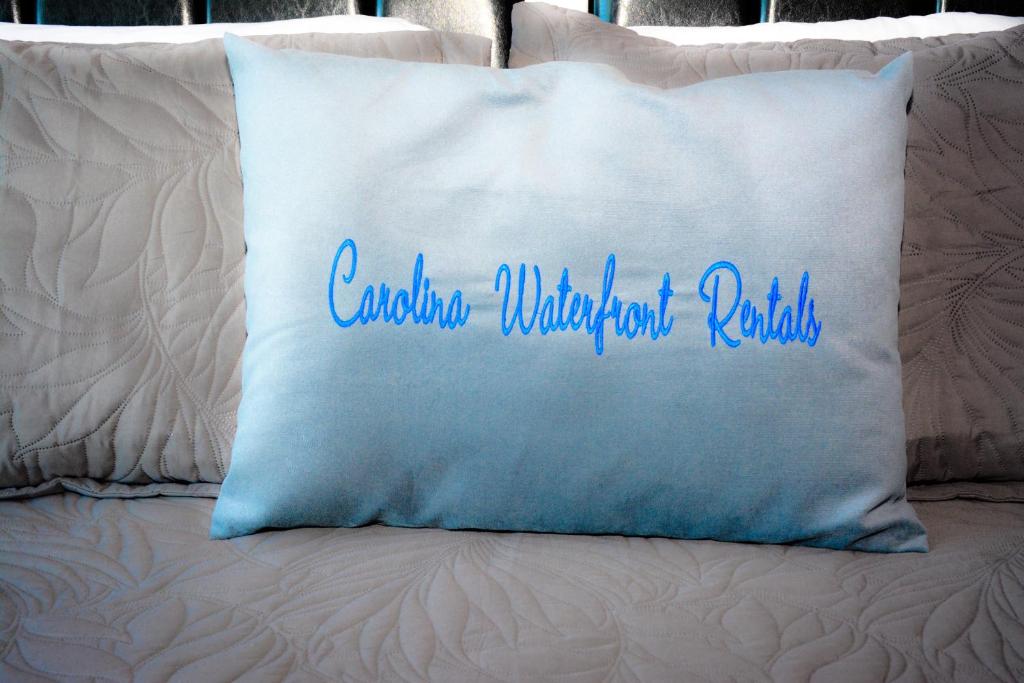 a pillow with the words cambodia wilderness rules on it at Large Private Room with Balcony and bathroom in Charleston