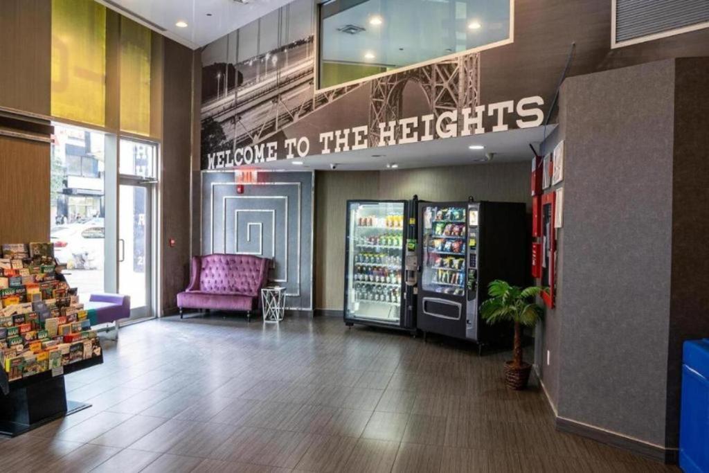 a store with a sign that reads promote to the heights at Hotel Moca NYC in New York