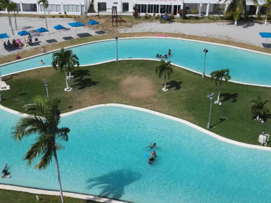 an overhead view of a large swimming pool at Beach-Style Pool Villa Paradise in Río Hato