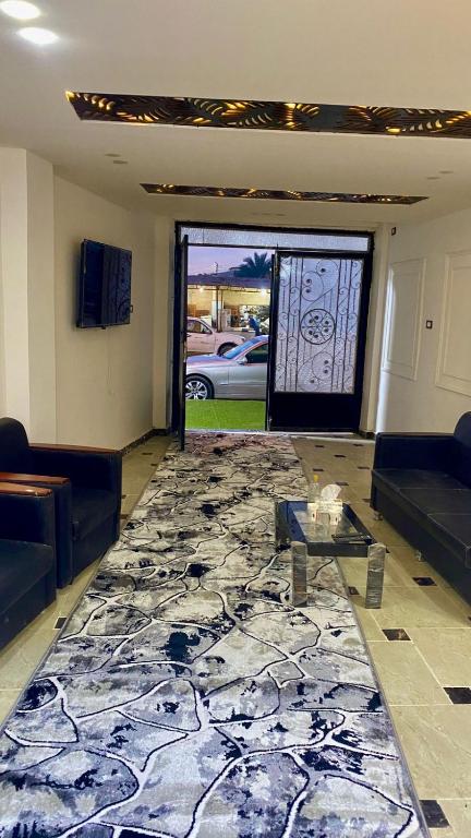 TV a/nebo společenská místnost v ubytování RAAK HOTEL فندق راك