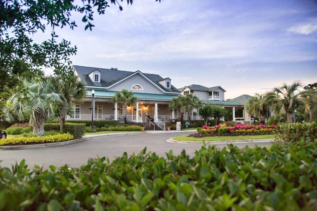 a large house with a driveway at Holiday Inn Club Vacations South Beach Resort in Myrtle Beach