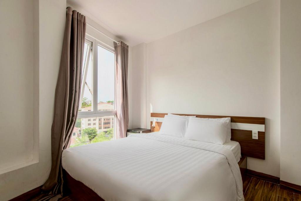 Postel nebo postele na pokoji v ubytování Khách sạn CLIFFHOUSE NHA TRANG