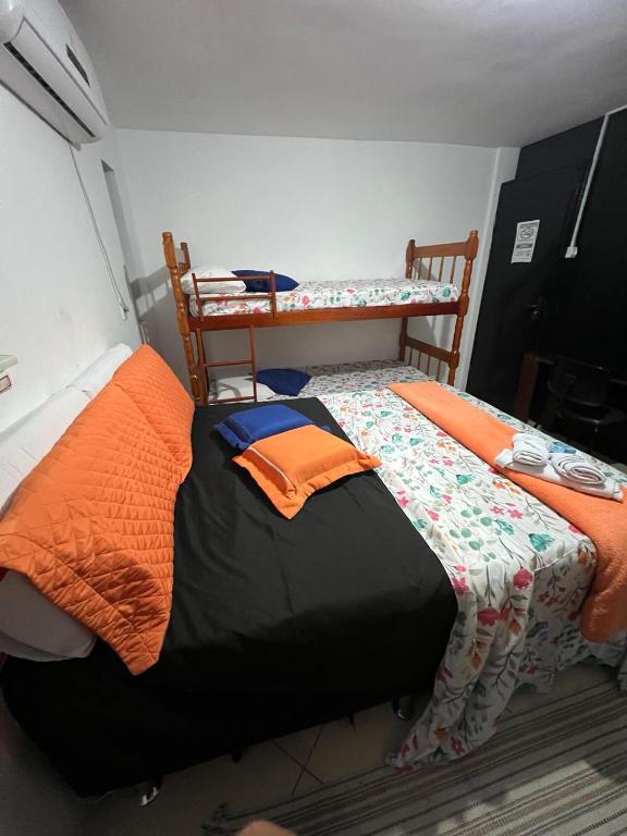 Postel nebo postele na pokoji v ubytování POUSADA DO HOSTEL