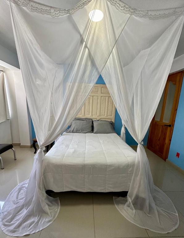 Postel nebo postele na pokoji v ubytování Huerta Don Felipe