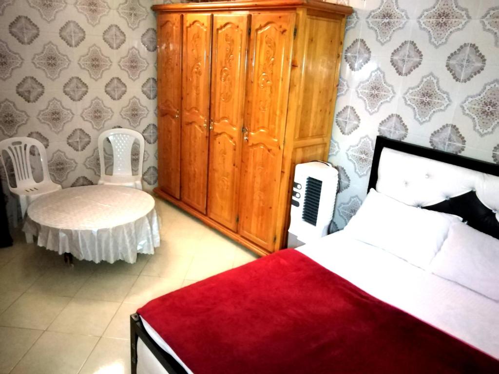 Una cama o camas en una habitación de Aziz House 2