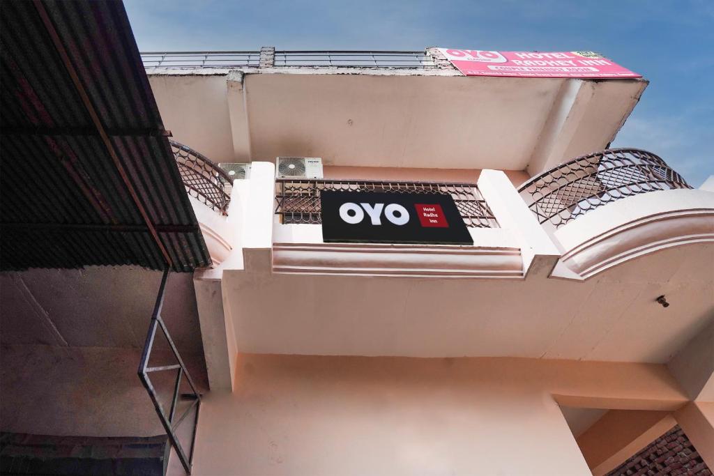 a sign on the side of a building at OYO Flagship Hotel Radhe Inn in Juhi Bari