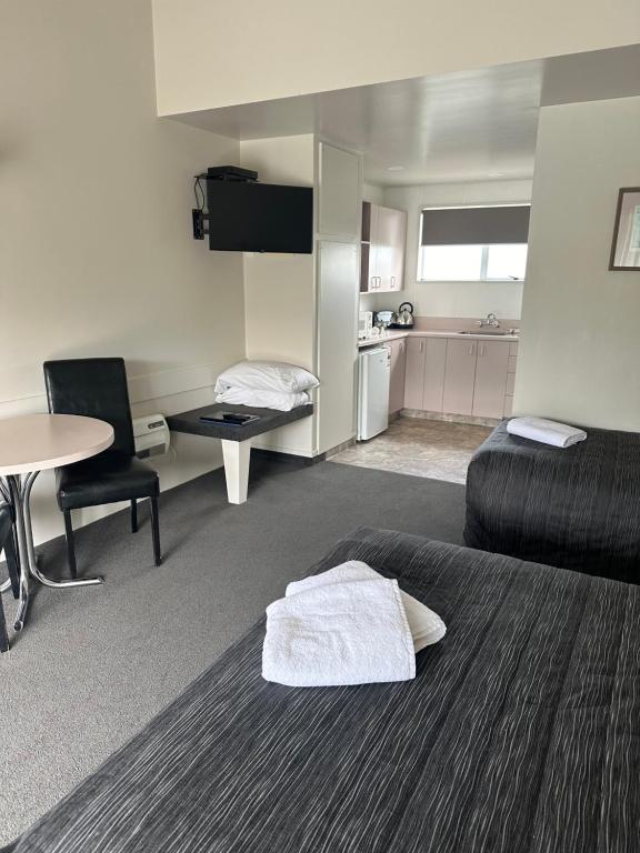 Postel nebo postele na pokoji v ubytování Helensborough Motor Inn