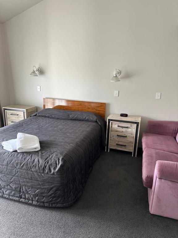 Postel nebo postele na pokoji v ubytování Helensborough Motor Inn