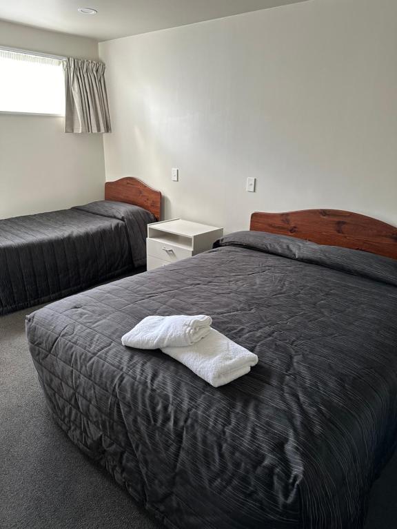 Postel nebo postele na pokoji v ubytování Helensborough Motor Inn