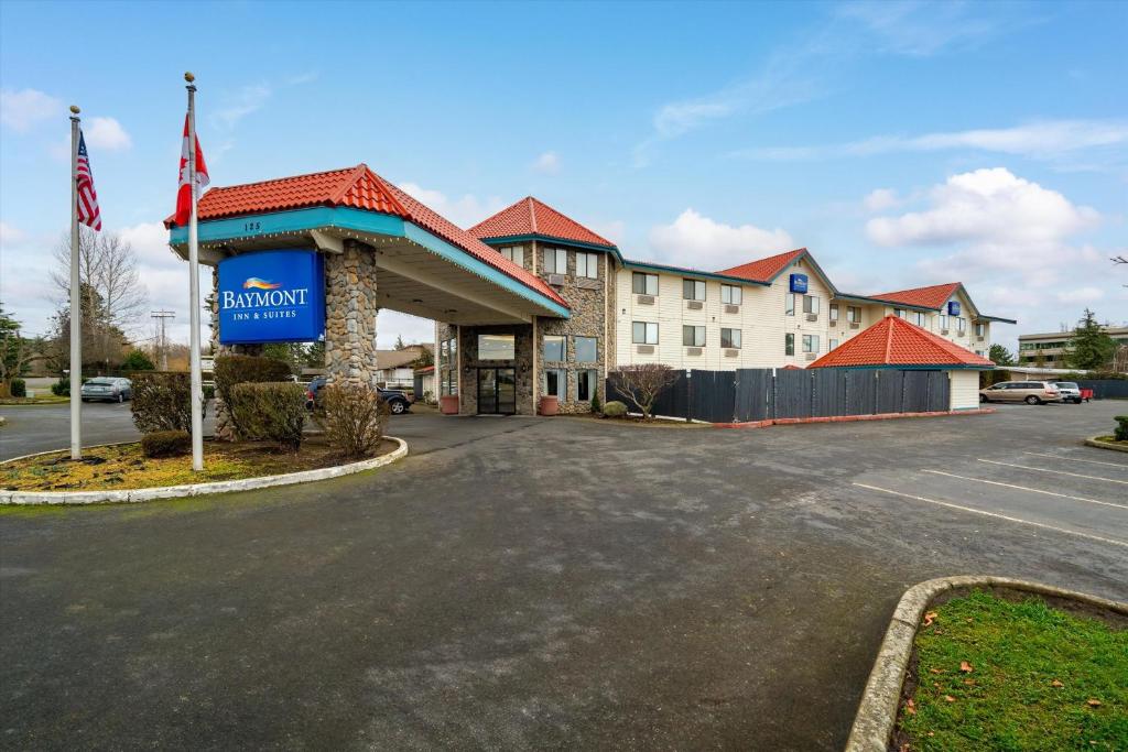 a hotel building with a sign in front of it at Baymont INN & Suites by Wyndham in Bellingham