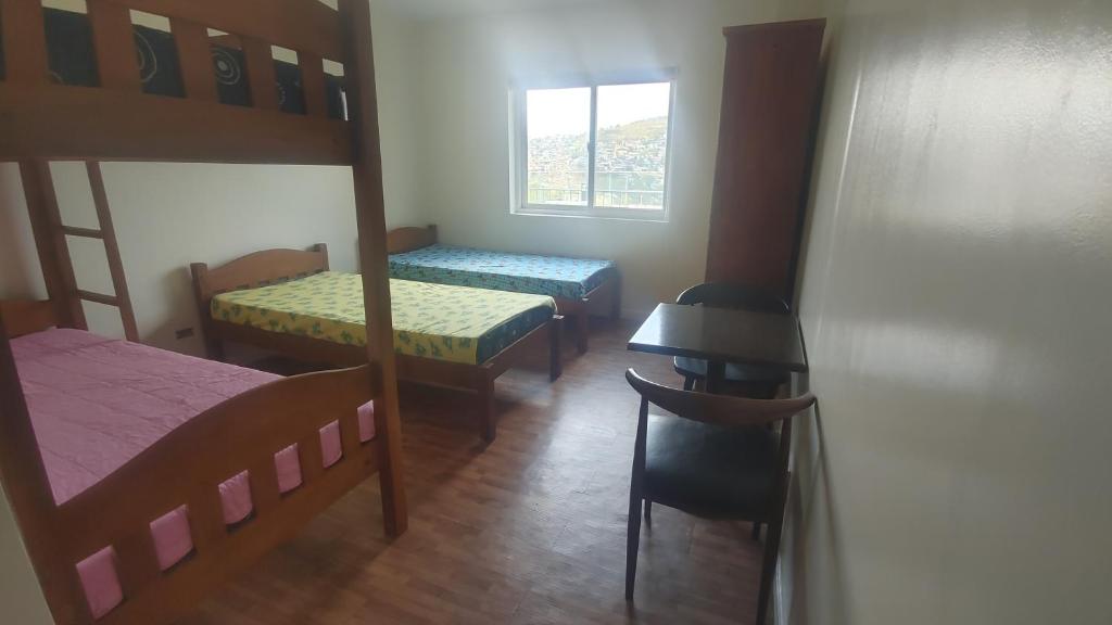 Postel nebo postele na pokoji v ubytování Baguio BELL Staycation
