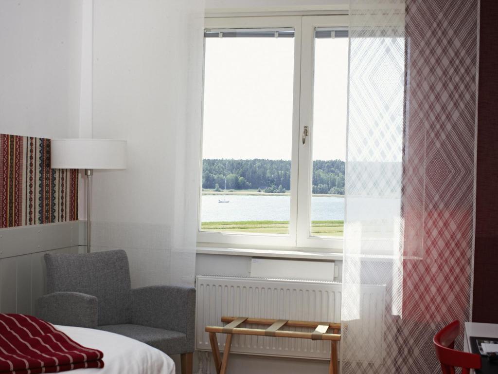 Postel nebo postele na pokoji v ubytování Runö Möten & Events