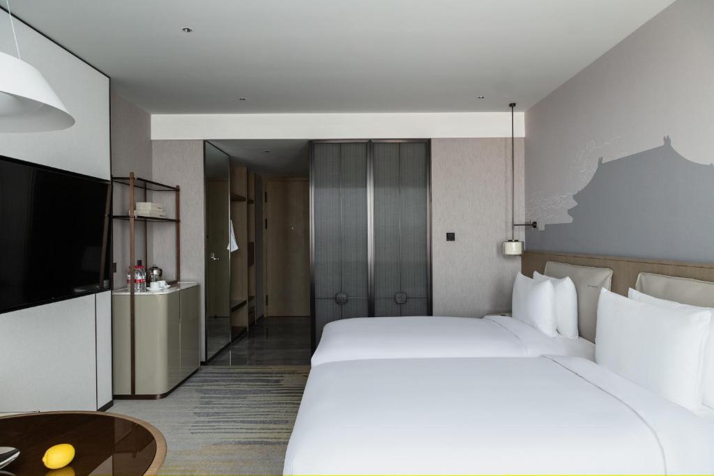 &#x633;&#x631;&#x64A;&#x631; &#x623;&#x648; &#x623;&#x633;&#x631;&#x651;&#x629; &#x641;&#x64A; &#x63A;&#x631;&#x641;&#x629; &#x641;&#x64A; Grand Metropark Yuantong Hotel Beijing