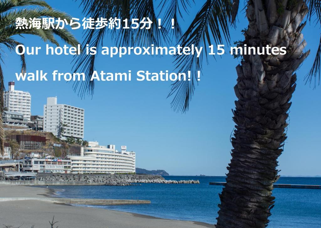 a palm tree on the beach with the words our hotel is approximately minutes walk at Wisterian Life Club Atami in Atami