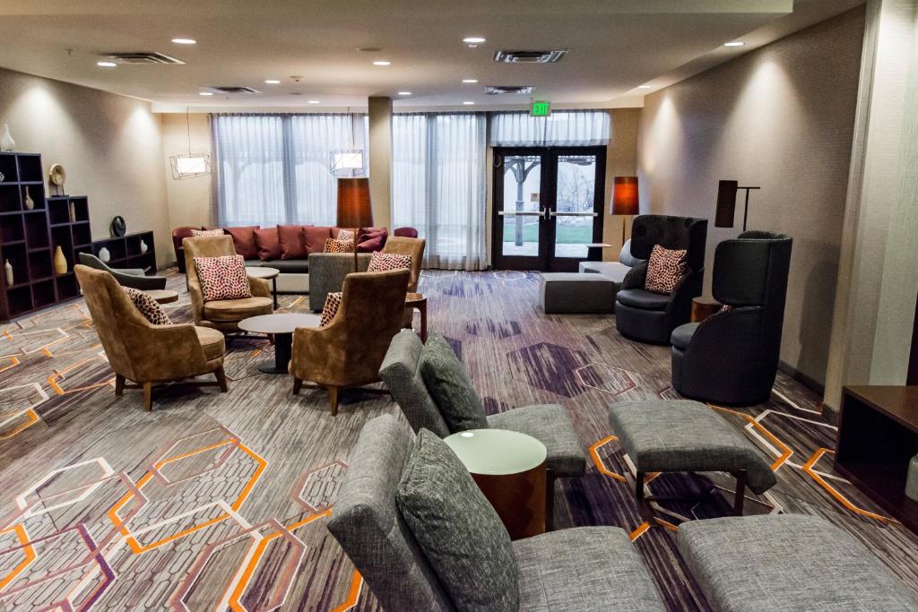a living room with couches and chairs in a lobby at Courtyard by Marriott Lafayette in Lafayette
