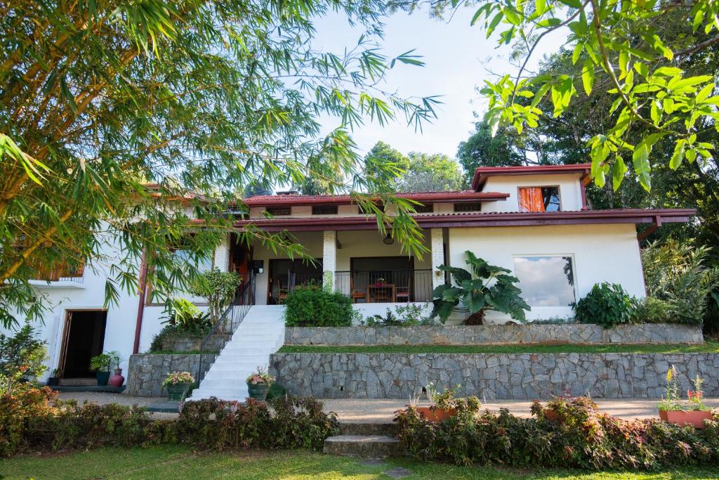 a house in the middle of a garden at Shenandoah Kandy in Kandy