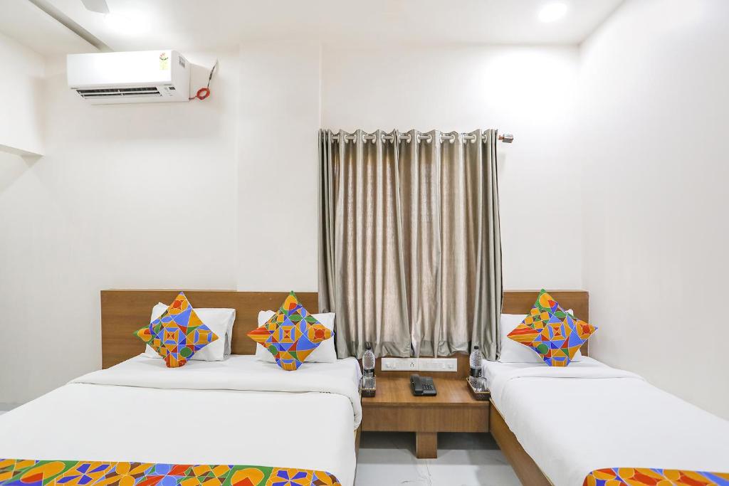 Postel nebo postele na pokoji v ubytování Hotel D Grand