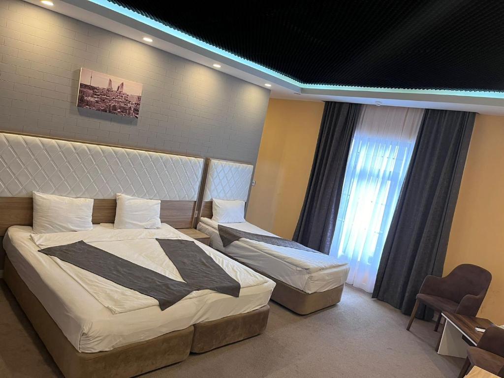 Postel nebo postele na pokoji v ubytování ZamZam-Madina Halal Hotels Group