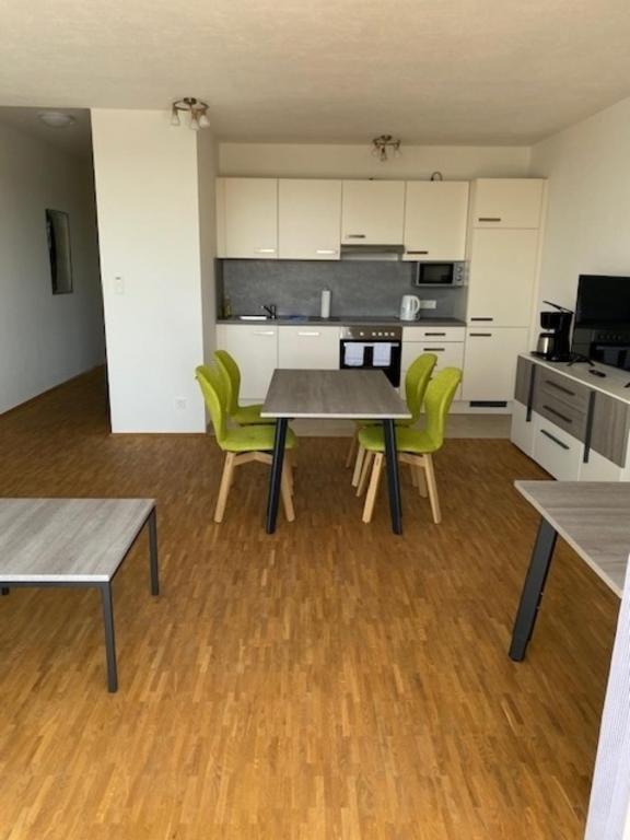 a kitchen with a table and chairs in a room at Appartement 24 in Oerlinghausen
