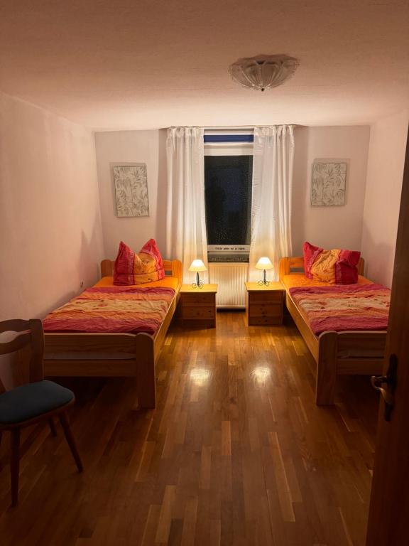 Postel nebo postele na pokoji v ubytování Pension FAULPELZ - Doppelzimmer Standard