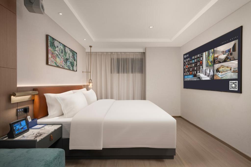 Postel nebo postele na pokoji v ubytování Insail Hotels Guangzhou Beijing Road Pedestrian Branch