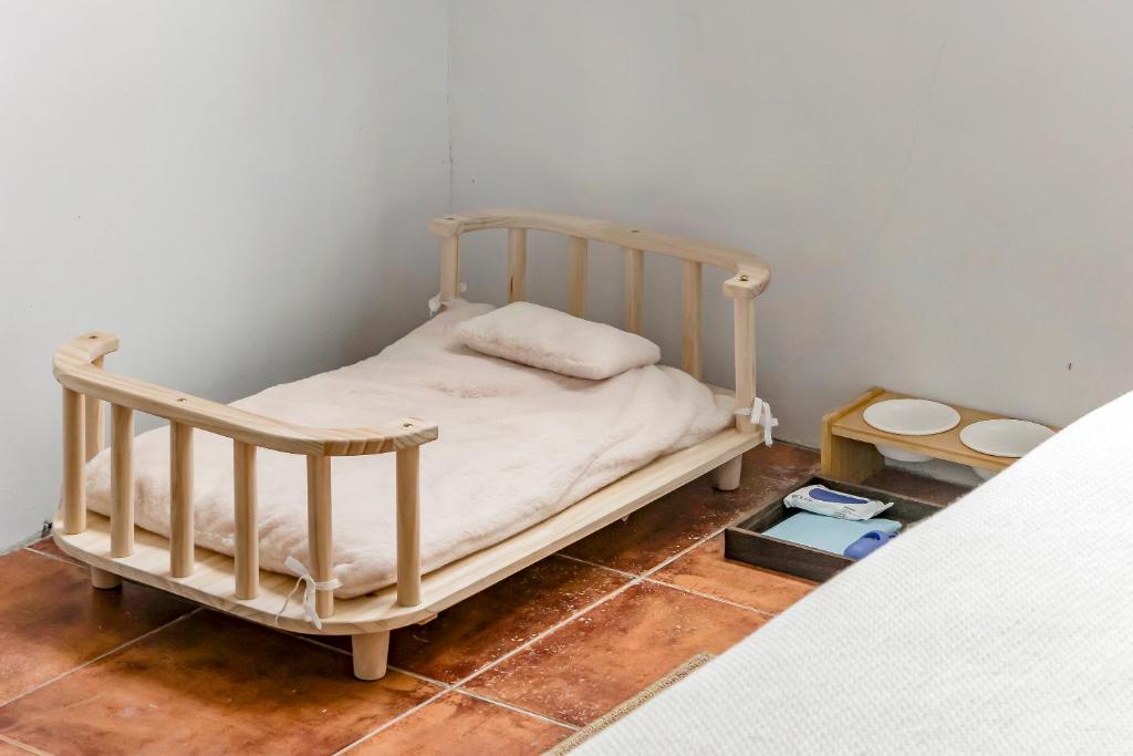 Postel nebo postele na pokoji v ubytování Kuma B&B