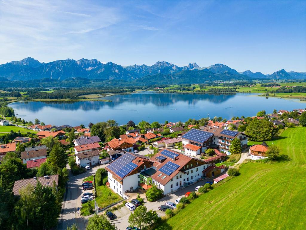 an aerial view of a town next to a lake at Biohotel Eggensberger in Füssen