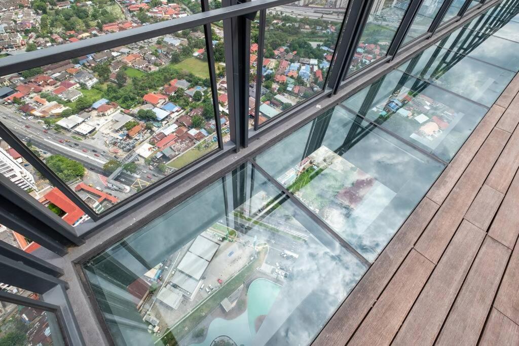 a view from the glass floor of a building at Cozy Nest@Platz Jalan Gombak Pool Gym MeMiZoooZooo in Kuala Lumpur