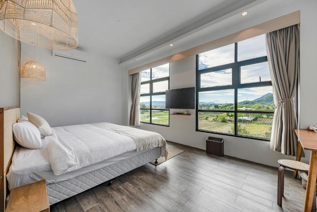 Postel nebo postele na pokoji v ubytování Kuma B&B