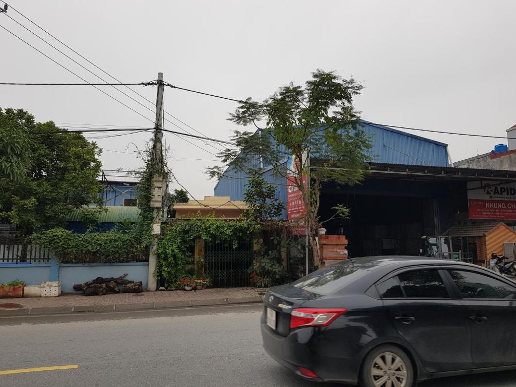 a black car parked on the side of a street at Mr. Khởi in Kim Côn