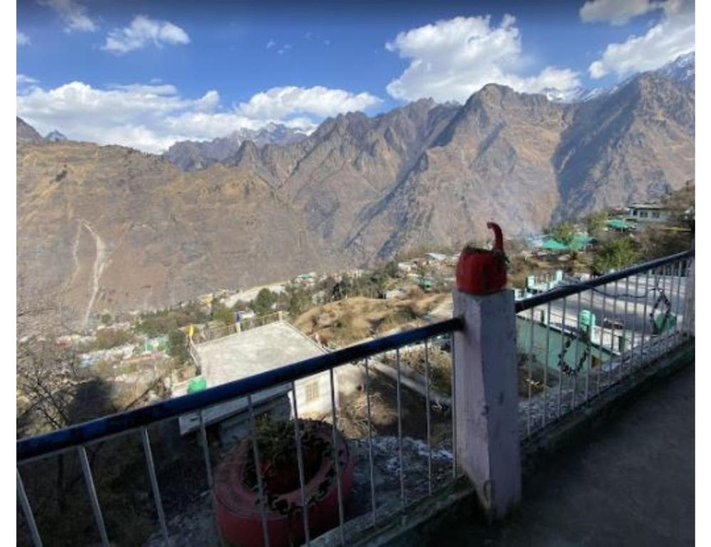a balcony with a view of a mountain at Nk Brothers Homestay, Joshimath in Joshīmath