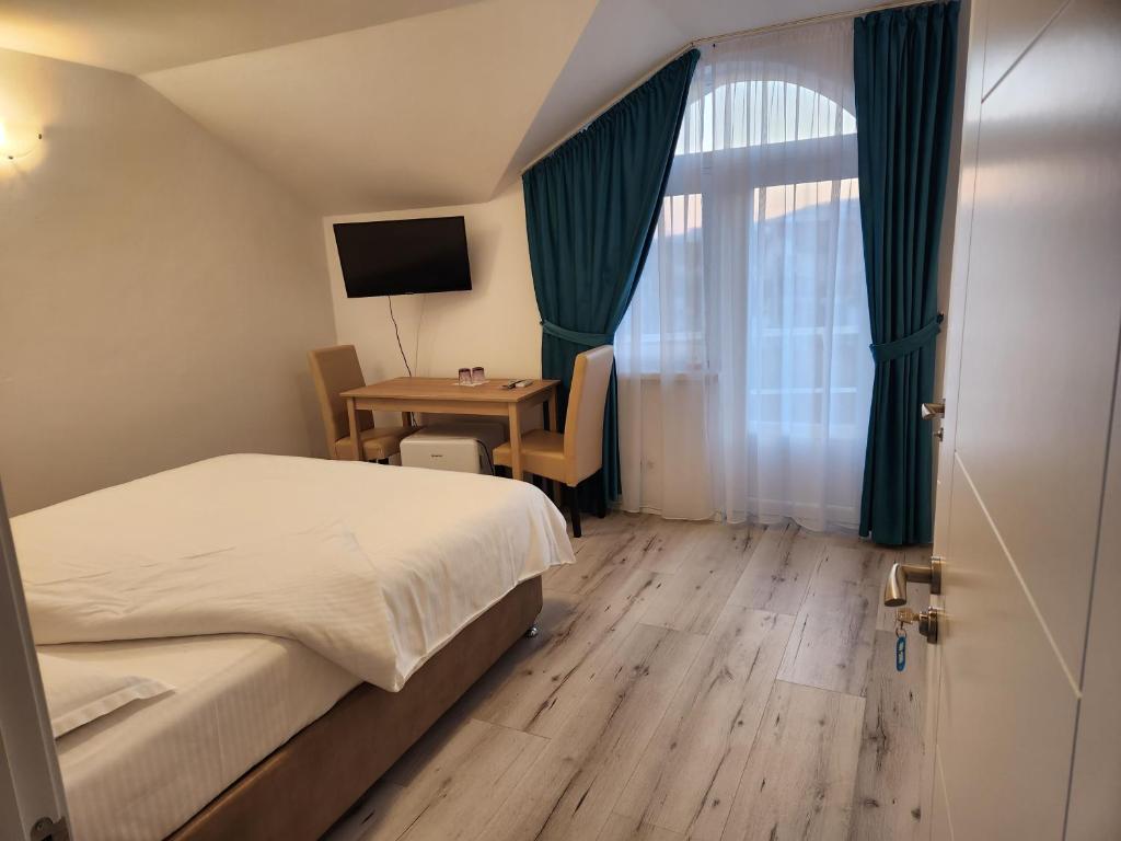Postel nebo postele na pokoji v ubytování Vila Reghina