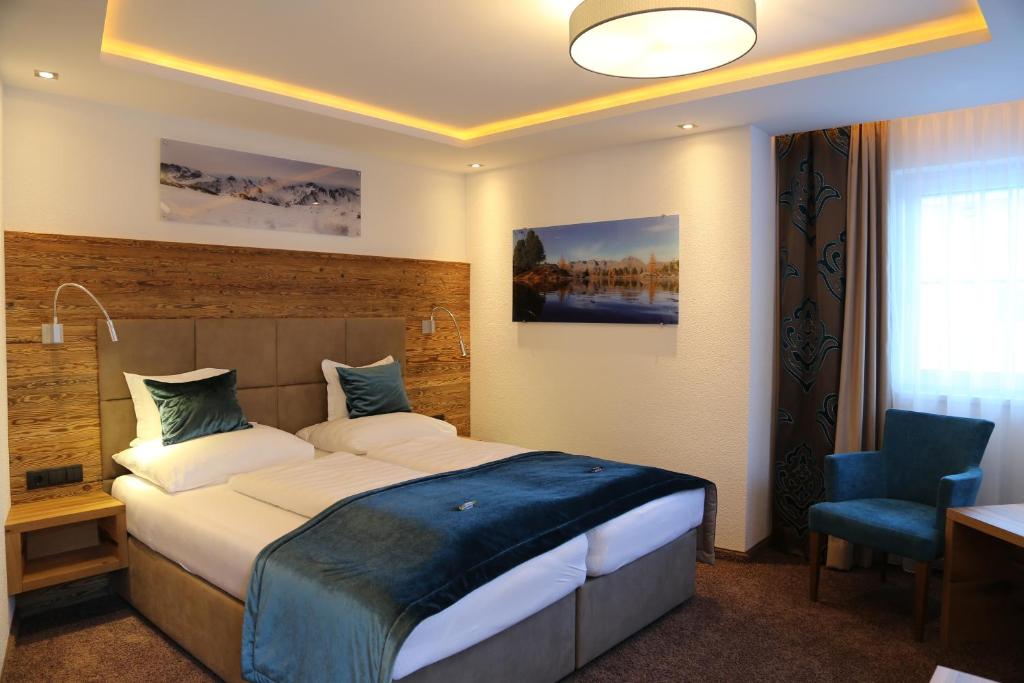 Postel nebo postele na pokoji v ubytování Hotel Vogt