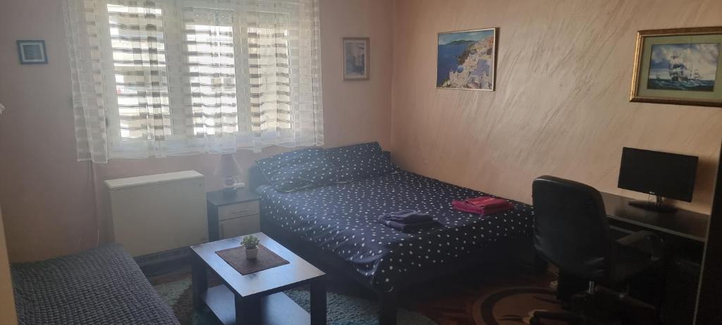 Кровать или кровати в номере Apartman Valdano