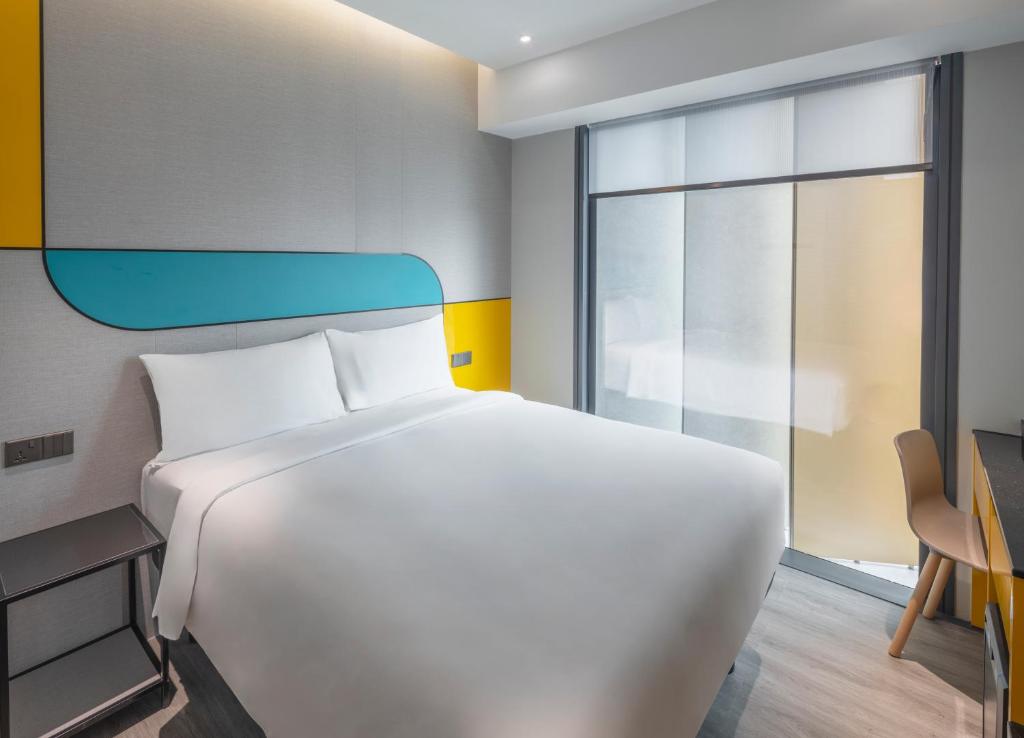 Giường trong phòng chung tại Hotel Mi Rochor